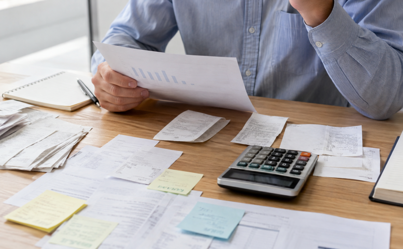 Business reviewer comparing an income story with receipts and expenses